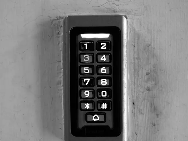 Backlit keypad entry panel on a building wall