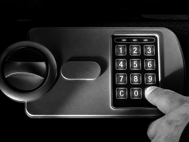 Hand entering a code on the keypad of a home safe